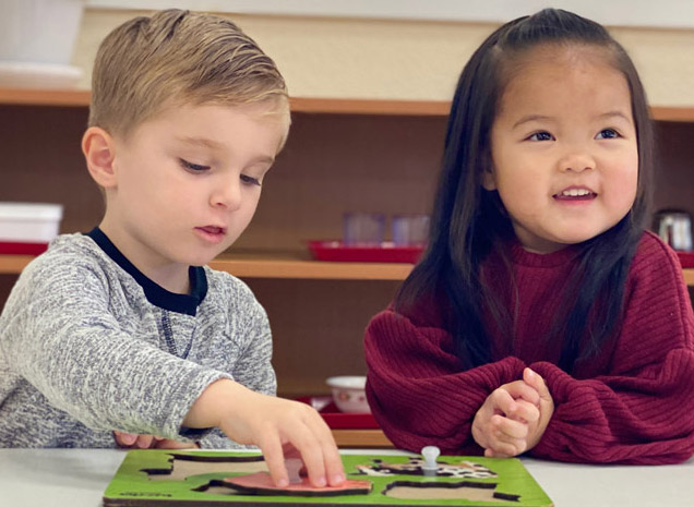 Montessori School at Washington Avenue teacher working with two-year old toddler program